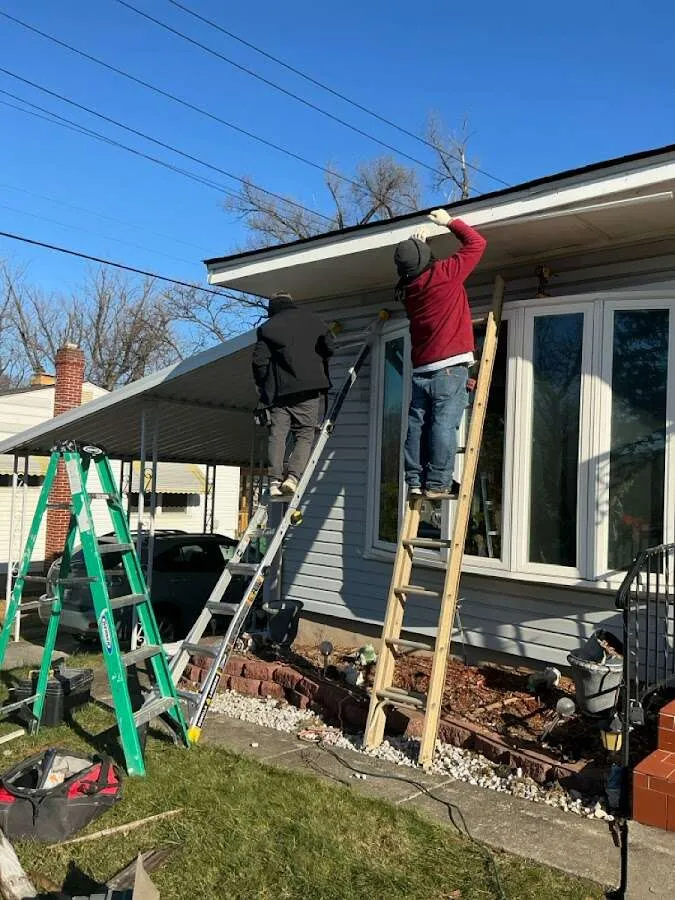 Restoration crew performing exterior repair in East Granby